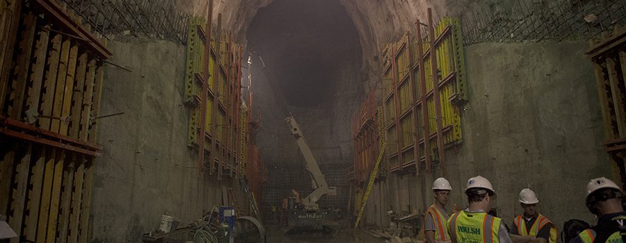 A large tunnel with workers in it.